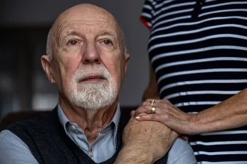 A caregiver spends time with her aging father as a way of helping a loved one with cancer feel less lonely.